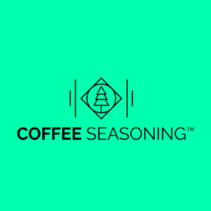 The logo features a geometric diamond enclosing a stylized tree, flanked by two vertical lines. Below, "COFFEE SEASONING™" is boldly displayed on a solid teal background, capturing the essence of your favorite coffee seasoning blend.