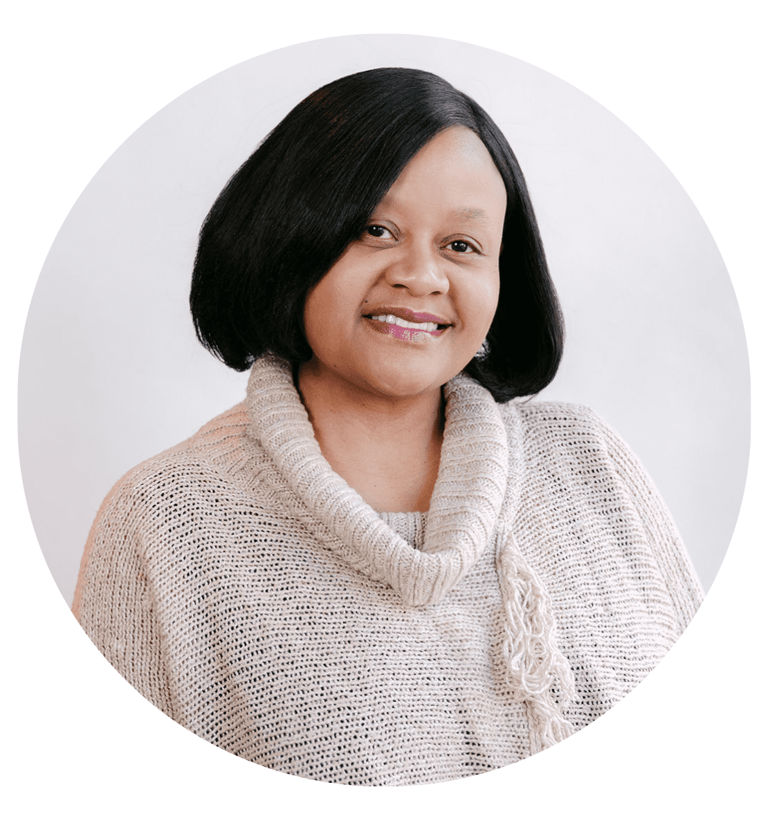 A woman with shoulder-length black hair wearing a beige knit sweater with a cowl neck, smiling softly, is pictured against a plain light background in a circular frame—an inviting image for the About RMMFI section.